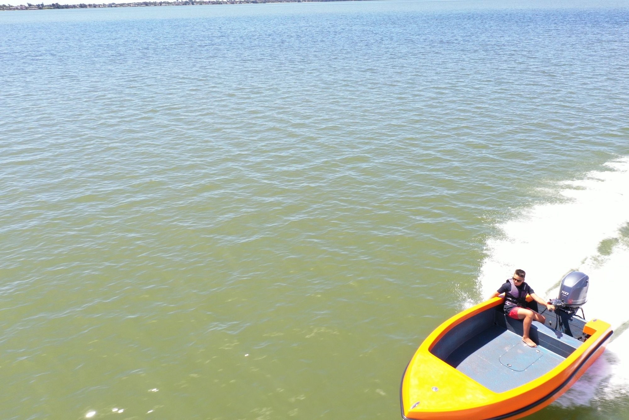 Mighty Boy turning hard, throwing a wake behind it